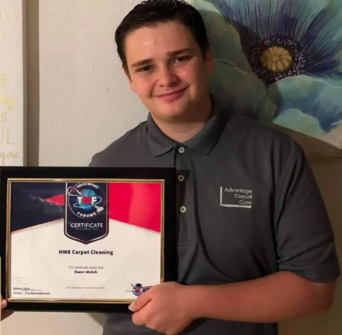 Owen Welch, team member of Advantage Carpet Care, providing professional carpet cleaning services on Oahu.